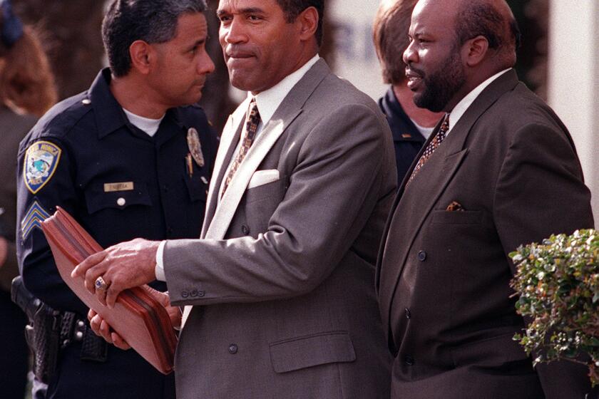 O.J. Simpson leaves a Santa Monica courthouse after his civil trial ended and the jury began deliberations on Jan. 18, 1997.