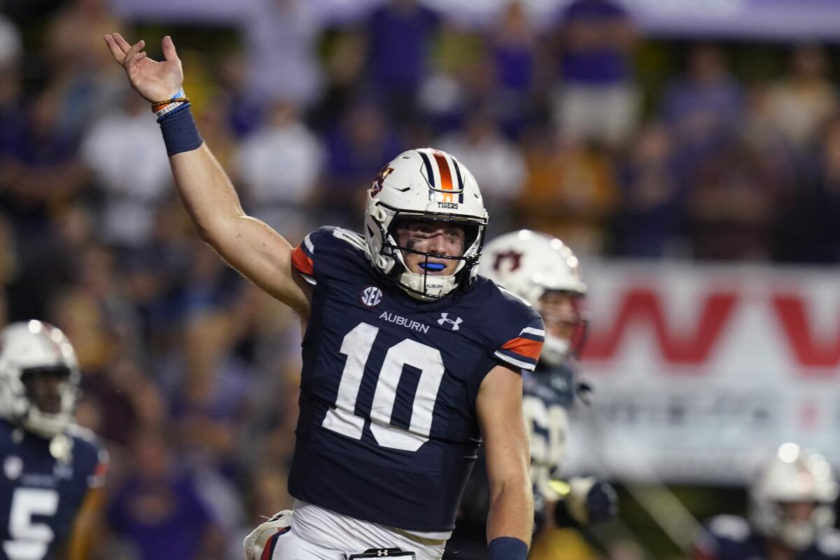 Auburn quarterback Bo Nix (10) celebrates after scoring a touchdown in the second half Oct. 2, 2021.