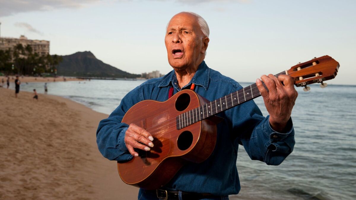 Ukulele legend Eddie Kamae plays a few songs on Waikiki Beach in 2013.