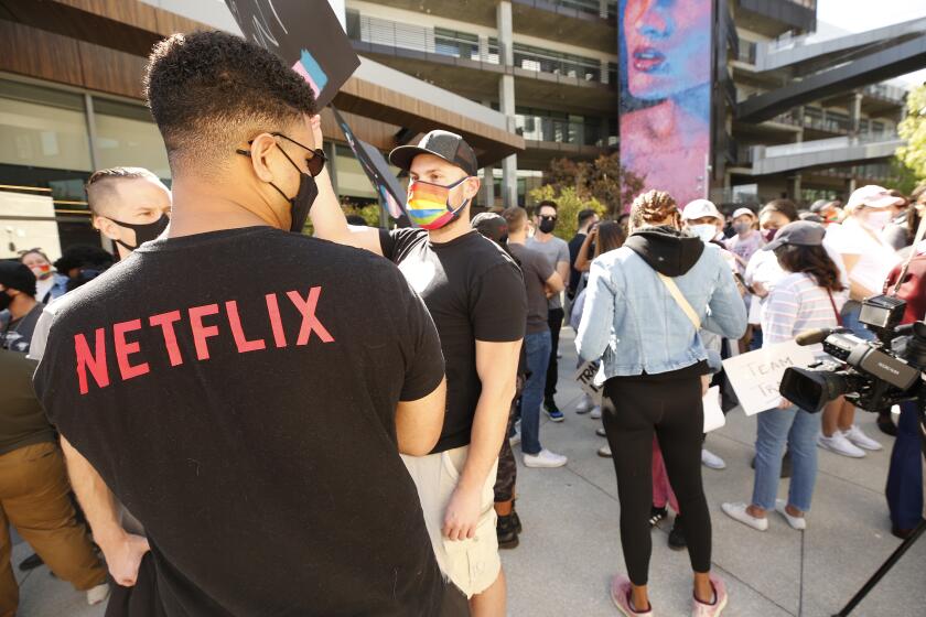 LOS ANGELES, CA - OCTOBER 20: Netflix employees, activists, public figures and supporters gathered outside a Netflix location at 1341 Vine St in Hollywood Wednesday morning in support as members of the Netflix employee resource group Trans*, coworkers and other allies staged a walkout to protest Netflix's decision to release Dave Chappelle's latest Netflix special, which contains a litany of transphobic material. Hollywood on Wednesday, Oct. 20, 2021 in Los Angeles, CA. (Al Seib / Los Angeles Times).