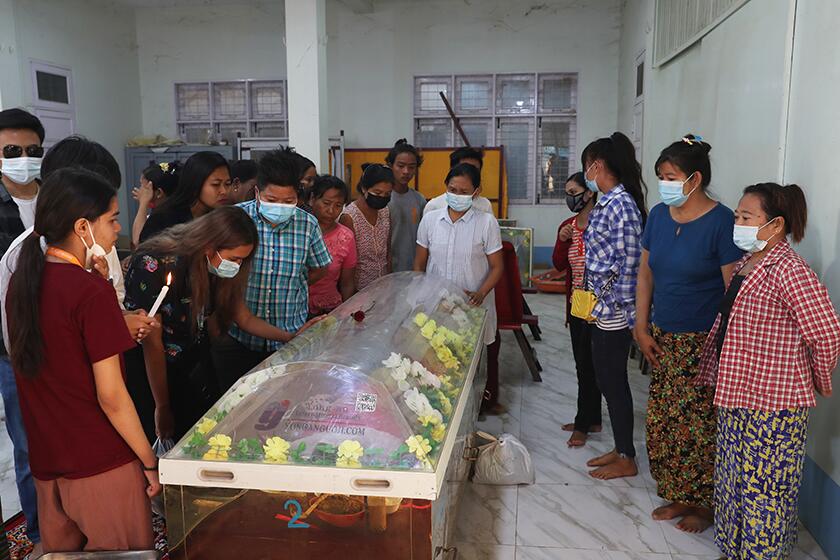 People mourn over the casket of Kyal Sin, 20, in Mandalay, Myanmar. The university student was shot in the head during an anti-coup protest.