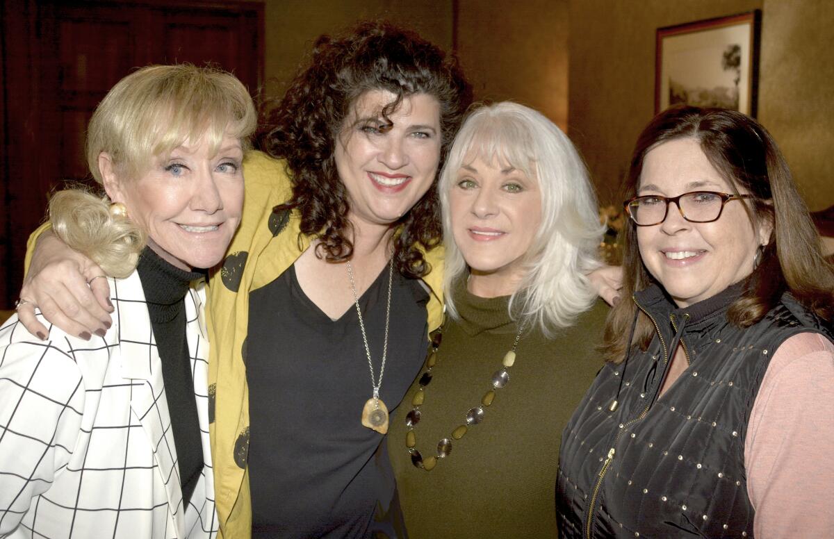 Among the guild members who witnessed Nancy Wiggins sworn in as president on Saturday were Donna Salant, from left, Ann Gardner, Max Andrews and Carol Thielemann.