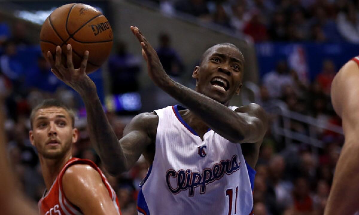 Clippers guard Jamal Crawford puts up a shot during a win over the Houston Rockets on Feb. 26. Crawford says shuffling between starting and bench roles hasn't been difficult for him.