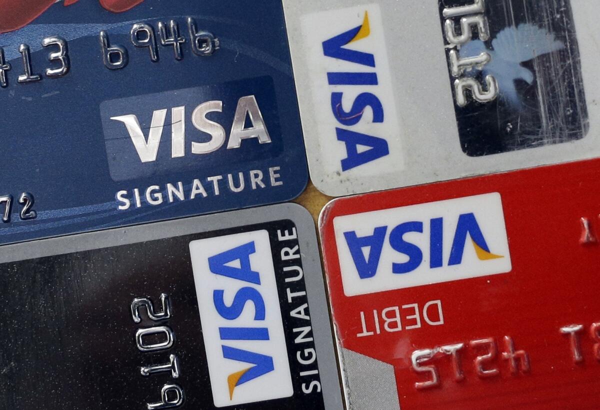 TransUnion reported that the average credit-card debt owed by consumers fell in the third quarter from a year earlier.