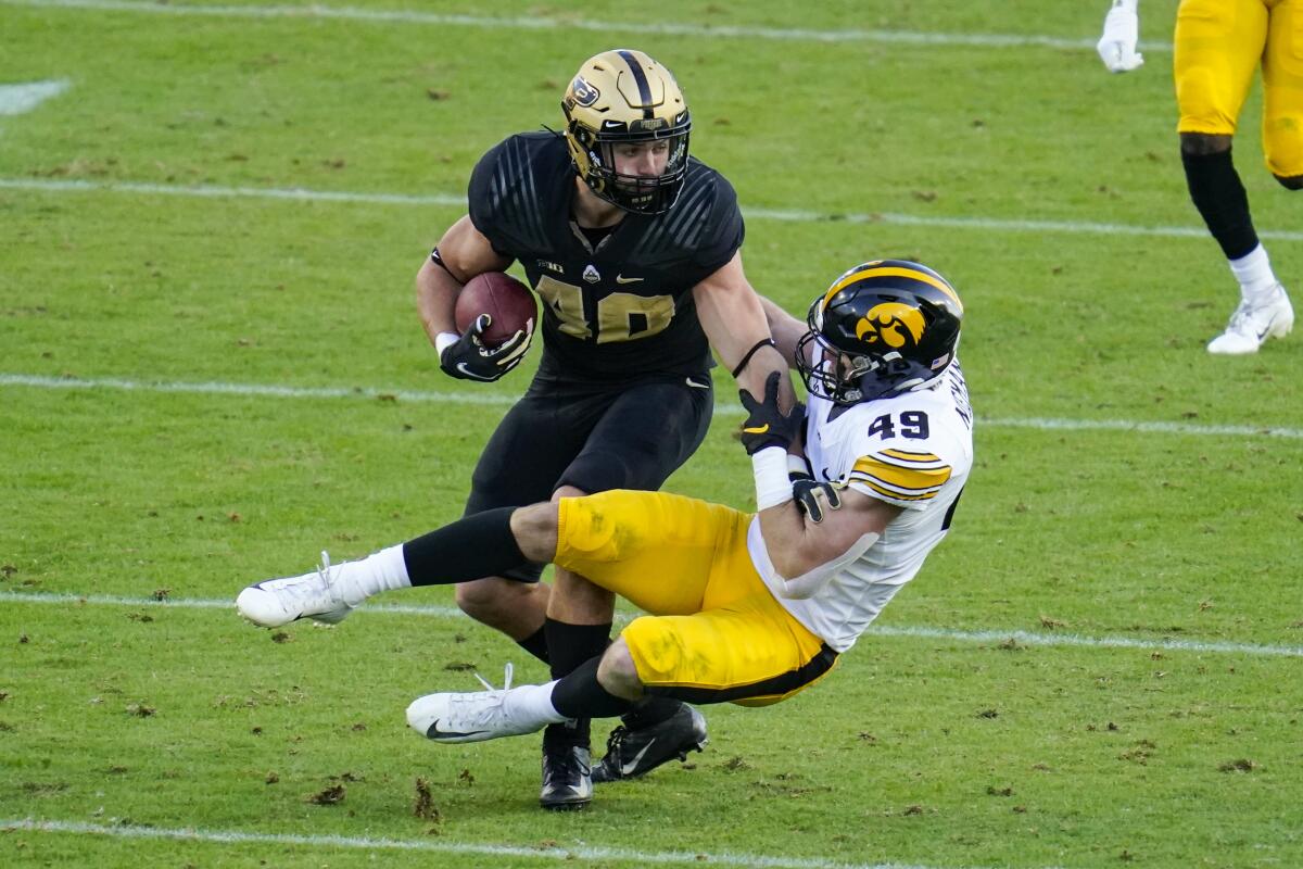 Purdue running back Zander Horvath is tackled by Iowa linebacker Nick Niemann in October.