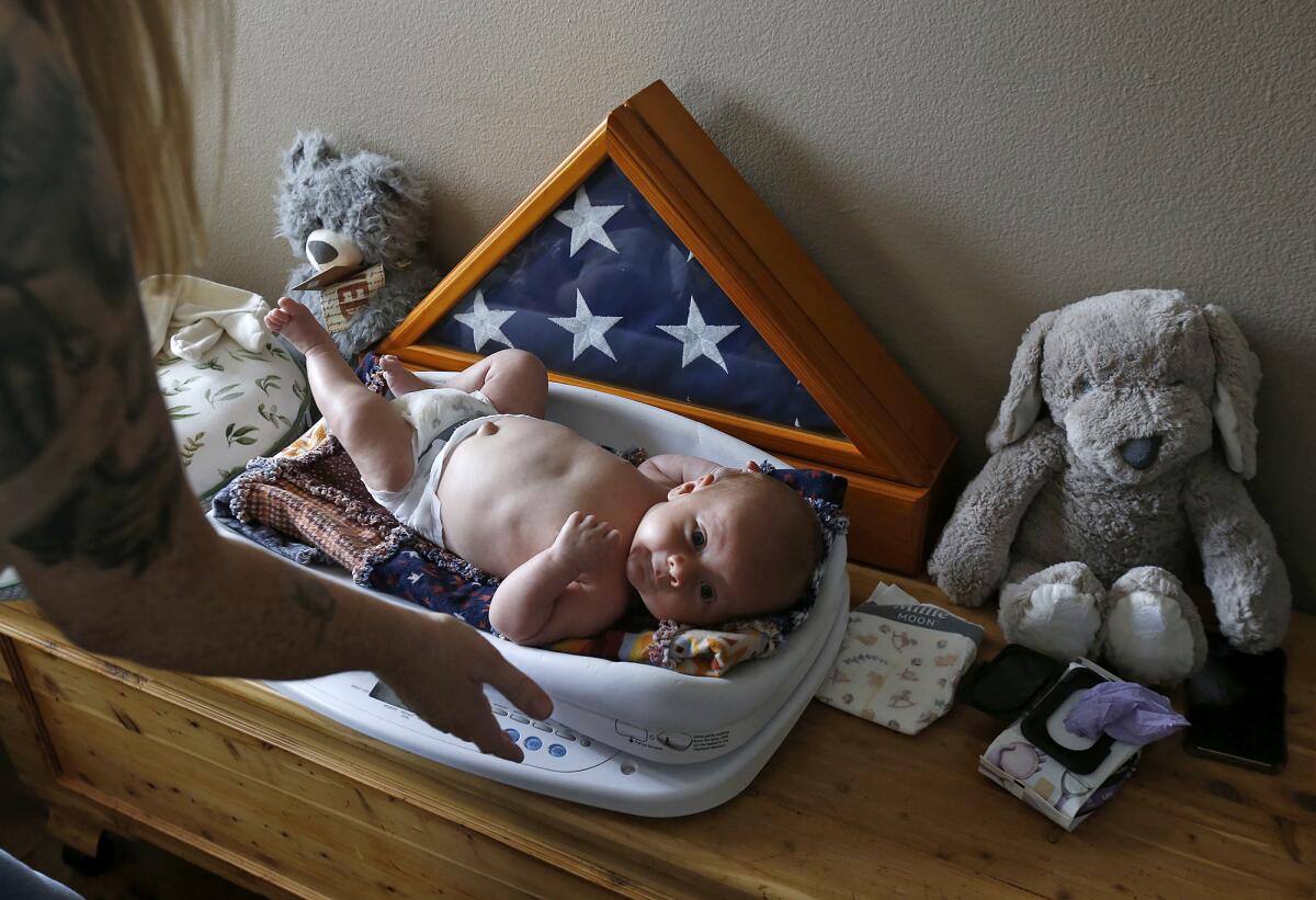 Six-week-old Bowen Ramos is weighed after breastfeeding in his Rancho Santa Margarita home.