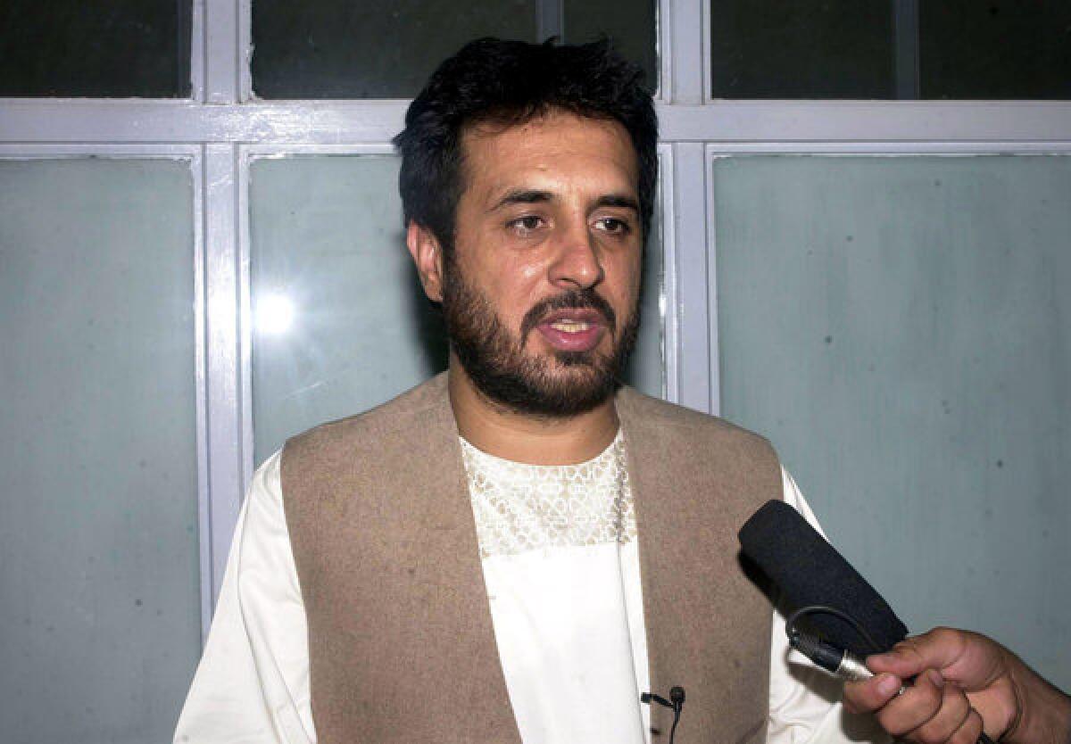 In a May 2007 file photo, Afghanistan's former Kandahar Gov. Asadullah Khalid and the country's current intelligence chief speaks to media at a hospital after surviving a suicide attack in the city of Kandahar, Afghanistan. Khalid was wounded in a bombing Thursday in the capital, Kabul, Afghan officials said.