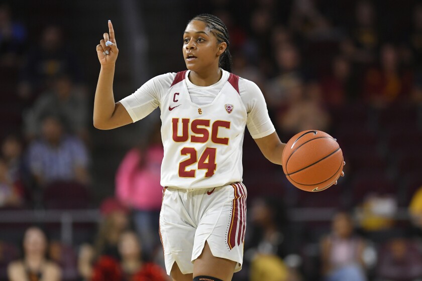 USC guard Desiree Caldwell brings the ball up the floor while playing Virginia.