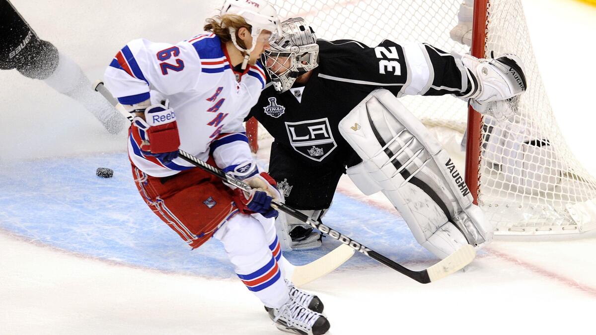 Rangers forward Carl Hagelin scores a short-handed goal oagainst Kings goalie Jonathan Quick during Game 1 of the 2014 Stanley Cup Final.