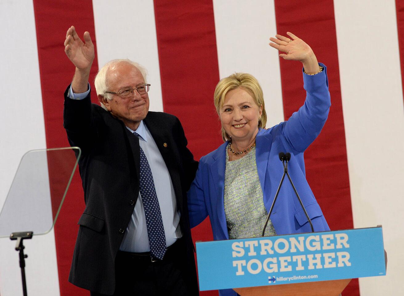 Bernie Sanders and presumptive Democratic presidential nominee Hillary Clinton appear together at Portsmouth High School on July 12, 2016, in Portsmouth, New Hampshire.