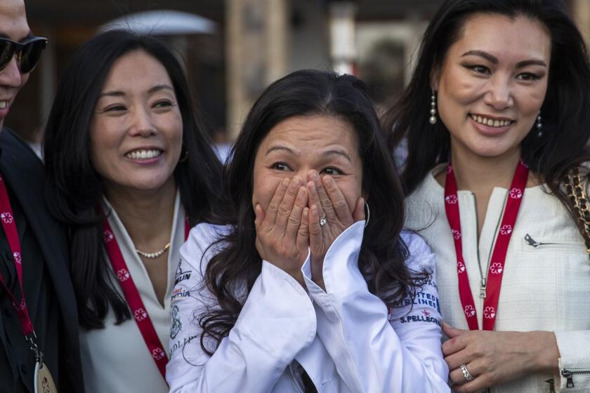 HUNTINGTON BEACH, CALIF. -- MONDAY, JUNE 3, 2019: n/naka, Culver City chef Niki Nakayama, center, celebrates after she and her restaurant was awarded a Michelin two-star status during a live reveal of the 2019 Michelin Guide California selection where the inaugural MICHELIN Guide California selection dining guide is announced at the Pasea Hotel & Spa in Huntington Beach, Calif., on June 3, 2019. (Allen J. Schaben / Los Angeles Times)