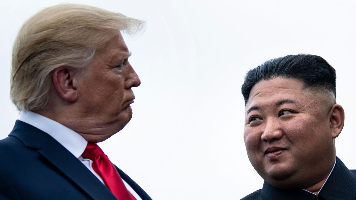 President Trump and North Korean leader Kim Jong Un talk in June 2019 before a meeting in the demilitarized zone.