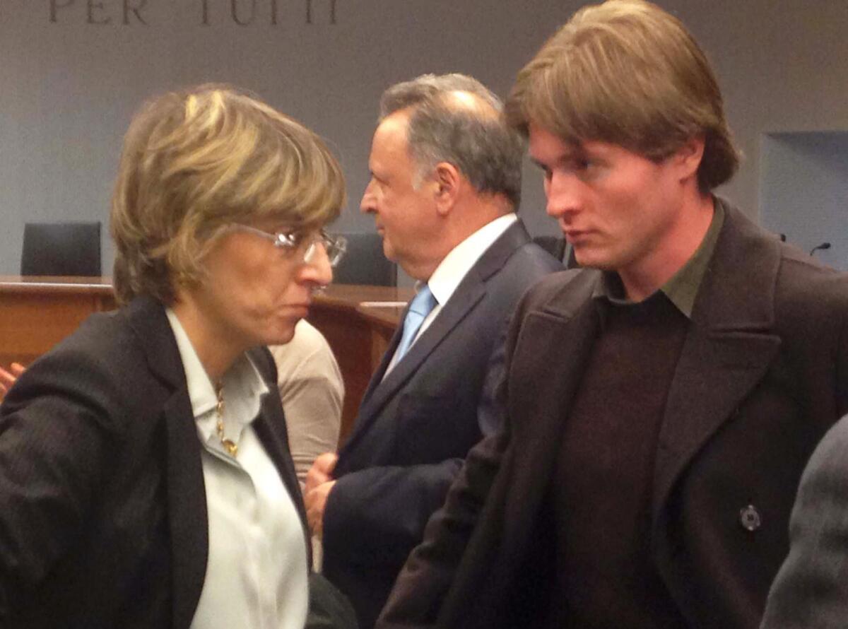 Amanda Knox's Italian ex-boyfriend, Raffaele Sollecito, right, stands up with his lawyer, Giulia Bongiorno, at a court hearing in Florence.