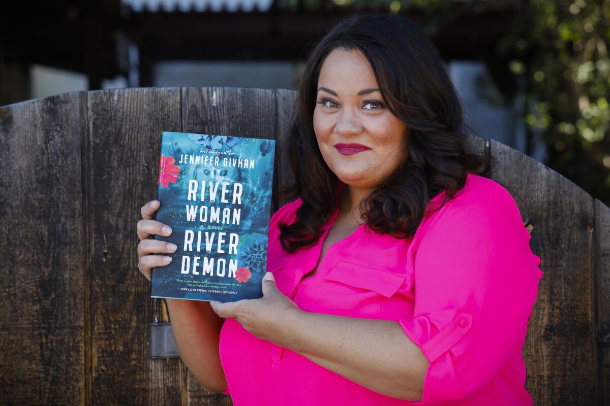 San Diego author Jennifer Givhan, photographed with a copy of her new book in Old Town Old Town, San Diego.