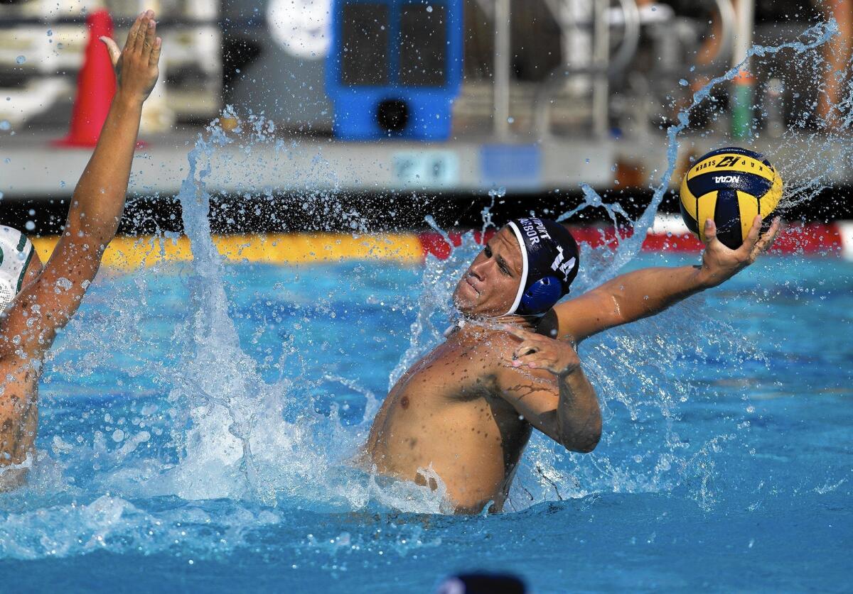 Newport Harbor High's Ryan Hurst attempts a buzzer-beater before halftime against Coronado during a season opener on Saturday in Newport Beach.