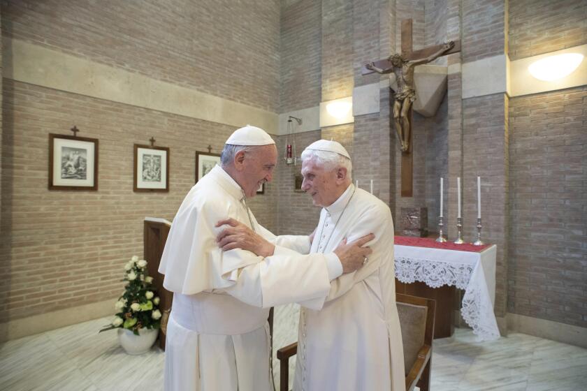 FILE - Pope Francis, left, embraces Emeritus Pope Benedict XVI, at the Vatican, June 28, 2017. Pope Francis on Wednesday, Dec. 28, 2022, said his predecessor, Pope Emeritus Benedict XVI, is “very sick," and he asked the faithful to pray for the retired pontiff so God will comfort him “to the very end.” (L'Osservatore Romano/Pool Photo via AP, File)