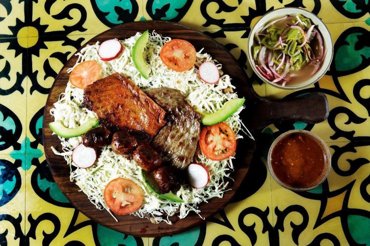 Tlayuda is among the Oaxacan classics on Madre's menu.