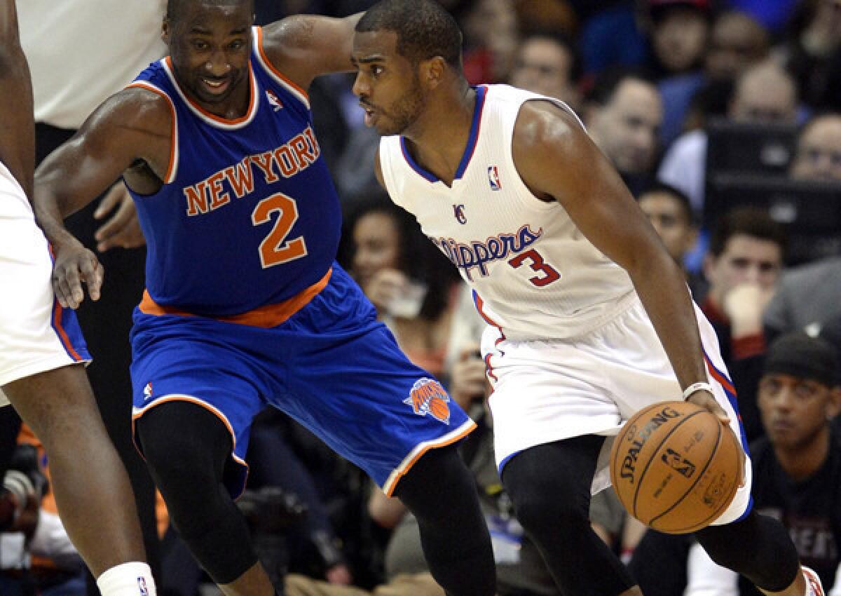Clippers point guard Chris Paul drives against Knicks point guard Raymond Felton in the second half of their game Wednesday night in New York.