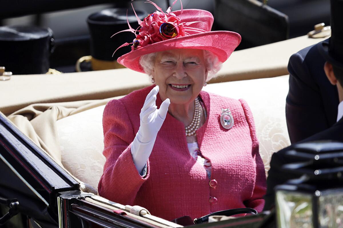 Queen Elizabeth II arrives at the Royal Ascot horse race meeting in 2018.  