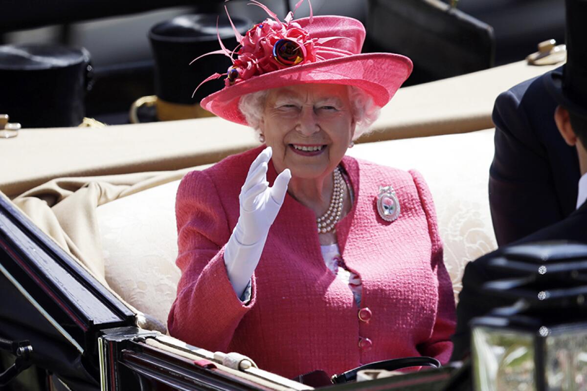 Queen Elizabeth II arrives at the Royal Ascot horse race meeting in 2018.