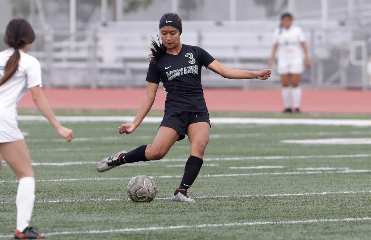 Costa Mesa's Jazmin Lopez strikes the ball for a long-shot goal in an Orange Coast League girls' soccer game on Thursday.