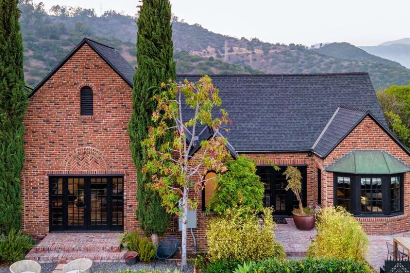 Built in 1927, the English Tudor-style home takes in views of Griffith Park on one side and Downtown L.A. on the other.