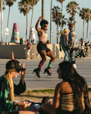 VENICE, CA - JUNE 29: Bianca Povalitis along with fellow roller skaters enjoy an evening at Venice Beach Skate Plaza one of the few remaining places in the Los Angeles Area to roller skate on Wednesday, June 29, 2022 in Venice, CA. (Jason Armond / Los Angeles Times)