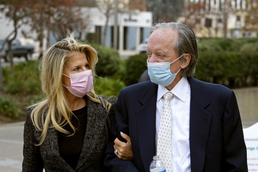 Bill Gross and partner Amy Schwartz arrive for a court hearing in Santa Ana, California, December 7, 2020. 