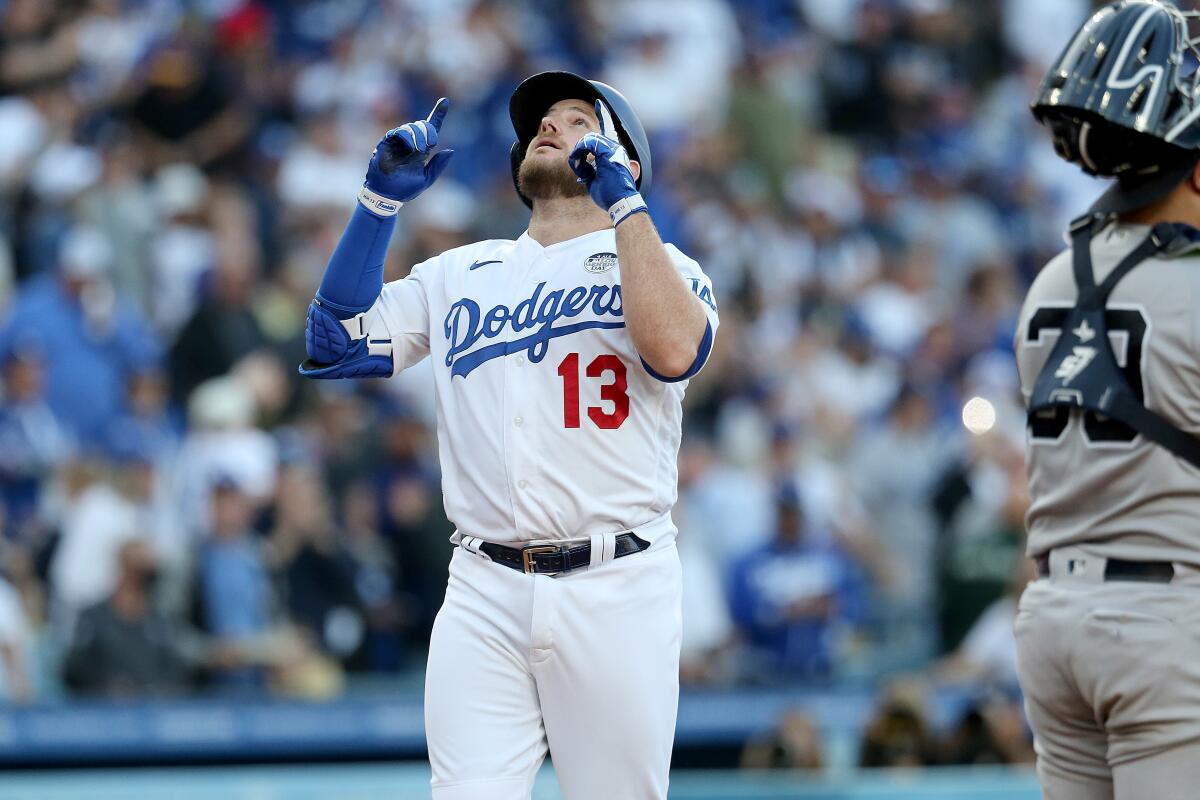 Dodgers third baseman Max Muncy celebrates after hitting a solo home run in the first inning Friday.