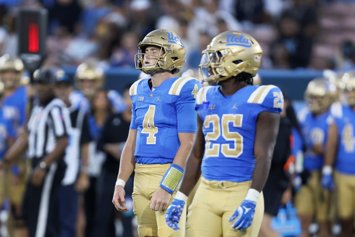 UCLA quarterback Ethan Garbers reacts next to running back TJ Harden after being sacked by Indiana in the Rose Bowl.