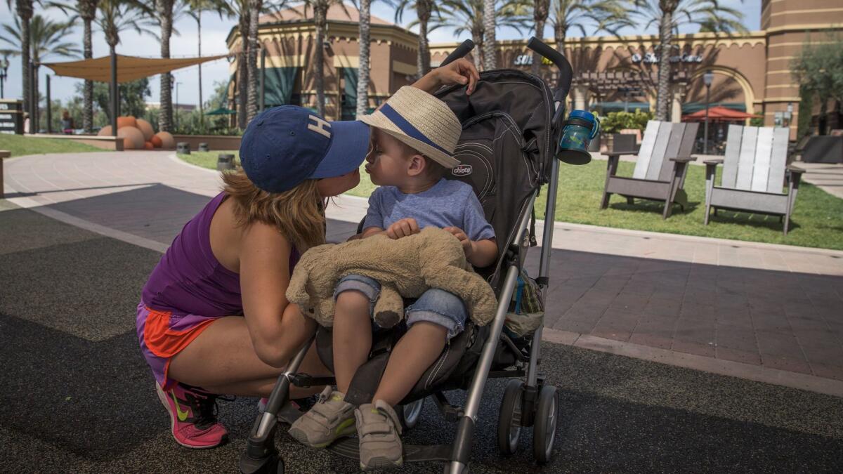 Heidi Smithers says the diversity is exactly what draws her to Irvine, allowing her and her son Charlie to learn more about people from different cultures. (Allen J. Schaben / Los Angeles Times)