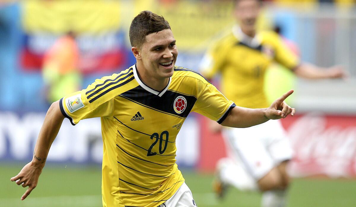 Midfielder Juan Quintero celebrates after scoring Colombia's second goal against Ivory Coast in a World Cup Group C game on Thursday at the Estadio Nacional in Brasilia.