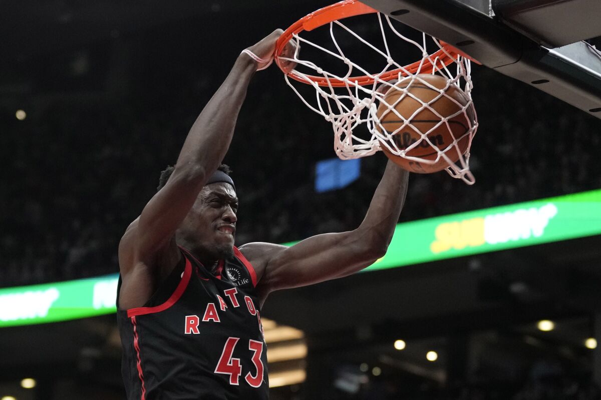 Toronto Raptors forward Pascal Siakam dunks against the Detroit Pistons during the first half of an NBA basketball game Friday, March 24, 2023, in Toronto. (Frank Gunn/The Canadian Press via AP)