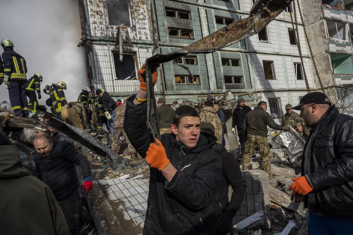 First responders removing rubble from residential building in central Ukraine