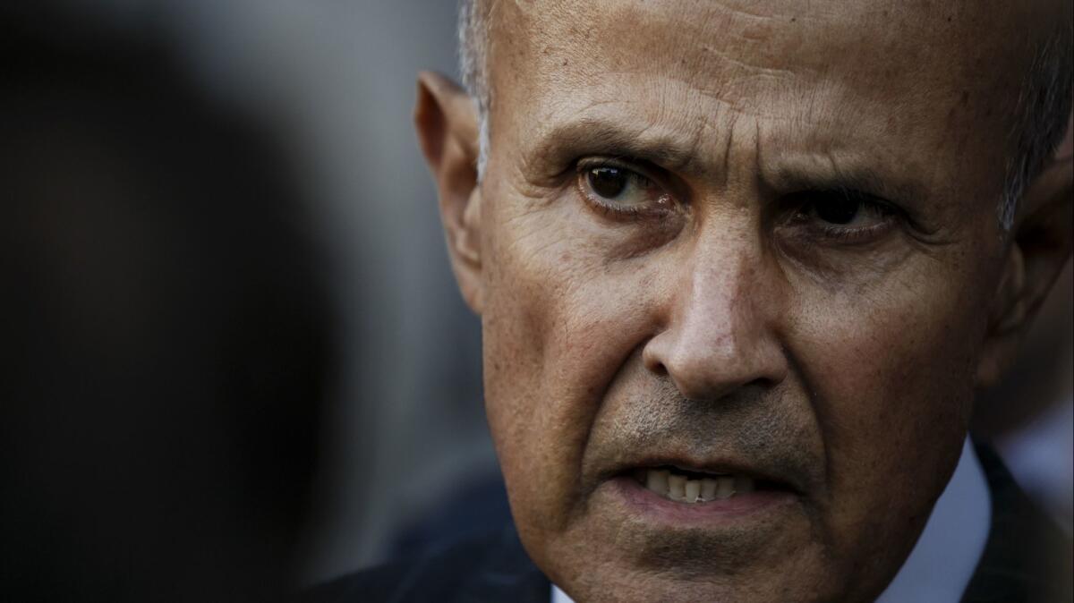 Former Los Angeles County Sheriff Lee Baca talks to reporters outside the federal courthouse in 2016.