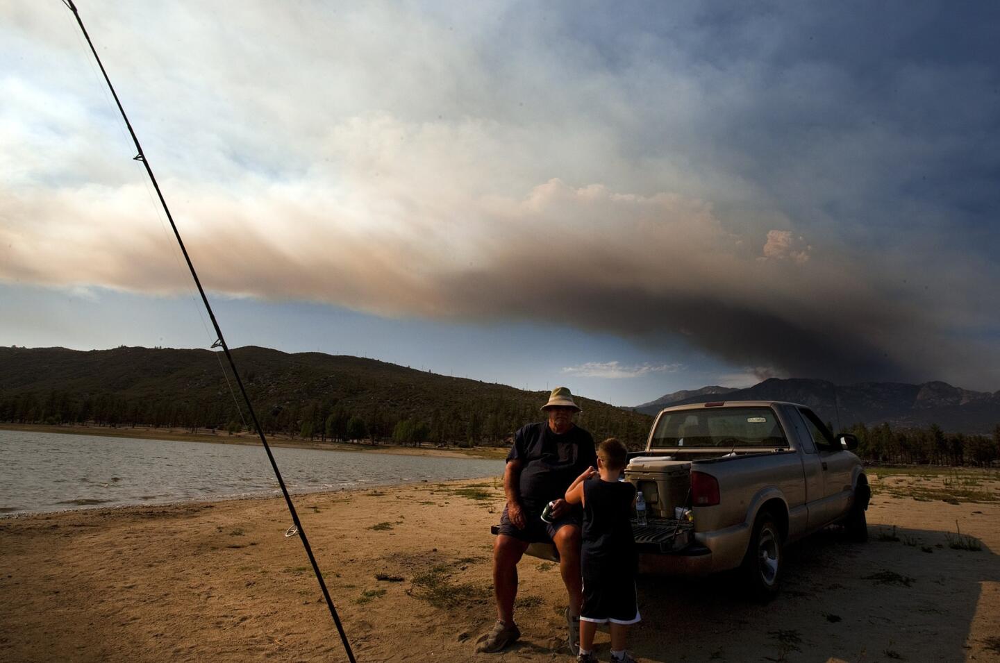 Fishing as fire rages