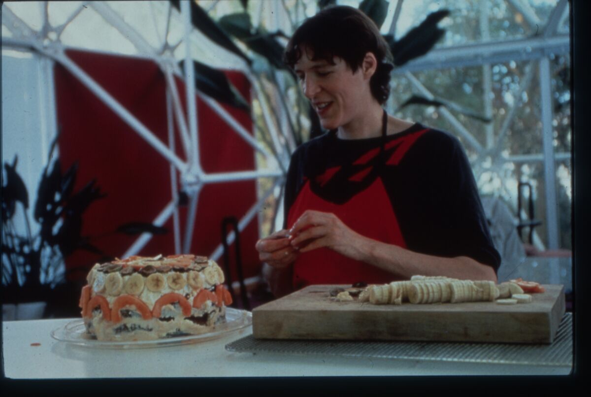 Sally Silverstone prepares a birthday cake in the documentary "Spaceship Earth."