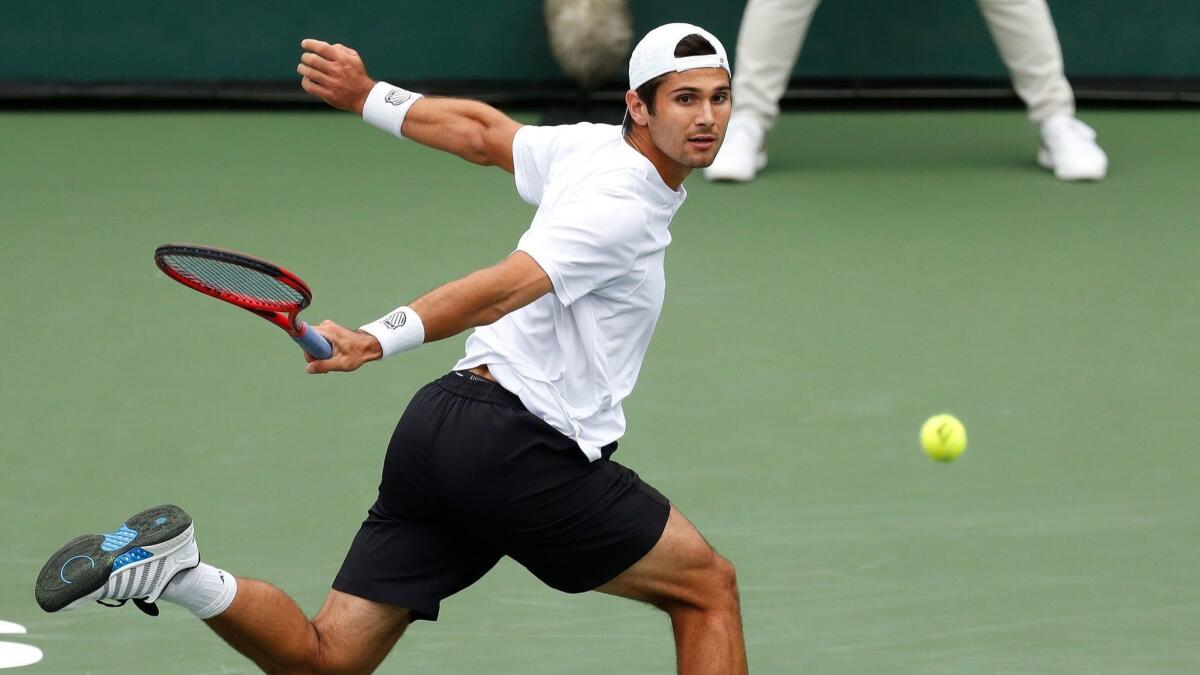 Marcos Giron returns a shot during a third-round loss to Milos Raonic on Monday at the BNP Paribas Open in Indian Wells.