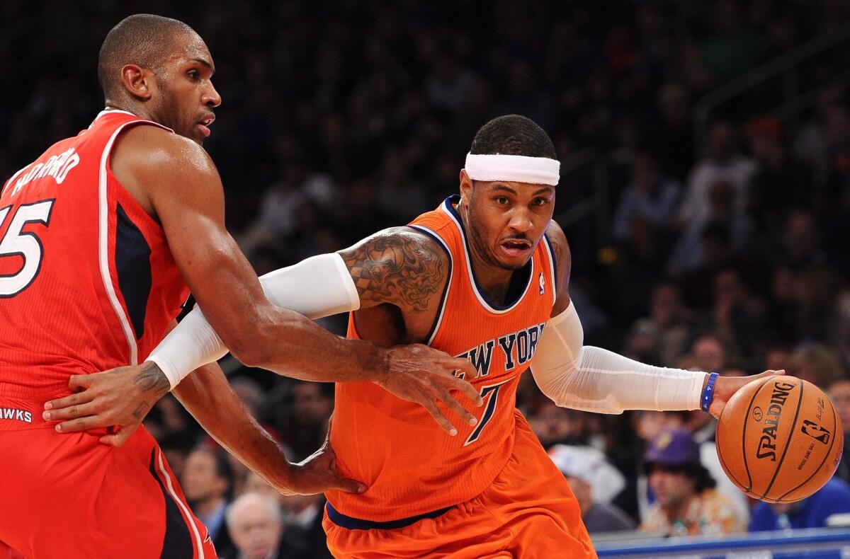 New York's Carmelo Anthony, driving past Atlanta's Al Horford early this season, is averaging 27 points a game.