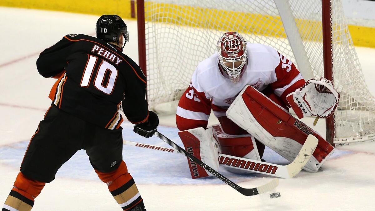 Ducks right wing Corey Perry scores on Detroit Red Wings goalie Jimmy Howard during the Ducks' 4-3 shootout win on Monday. Much to the chagrin of some hockey purists, the shootout has become an integral part of the NHL.