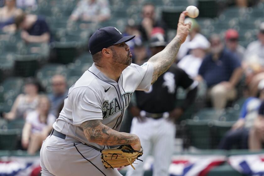 Seattle Mariners relief pitcher Hector Santiago throws against the Chicago White Sox during the third inning in the first baseball game of a doubleheader in Chicago, Sunday, June 27, 2021. (AP Photo/Nam Y. Huh)