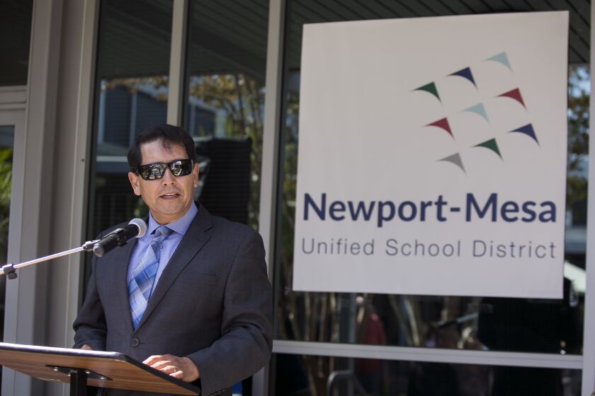 Dr. Fred Navarro speaks during a time capsule burial event at the Newport-Mesa Unified School District offices on Friday, June 2.
