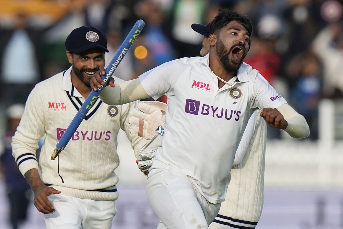 India's Mdohammed Siraj, right, celebrates after taking the wicket clean bowled of England's James Anderson, with India winning the 2nd test, during the fifth day of the 2nd cricket test between England and India at Lord's cricket ground in London, Monday, Aug. 16, 2021. (AP Photo/Alastair Grant)
