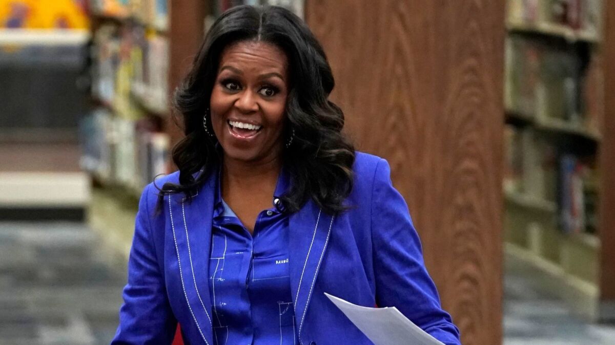 Former First Lady Michelle Obama at Whitney M. Young Magnet High School in Chicago on Monday, the day before her already-bestselling book "Becoming" was released.