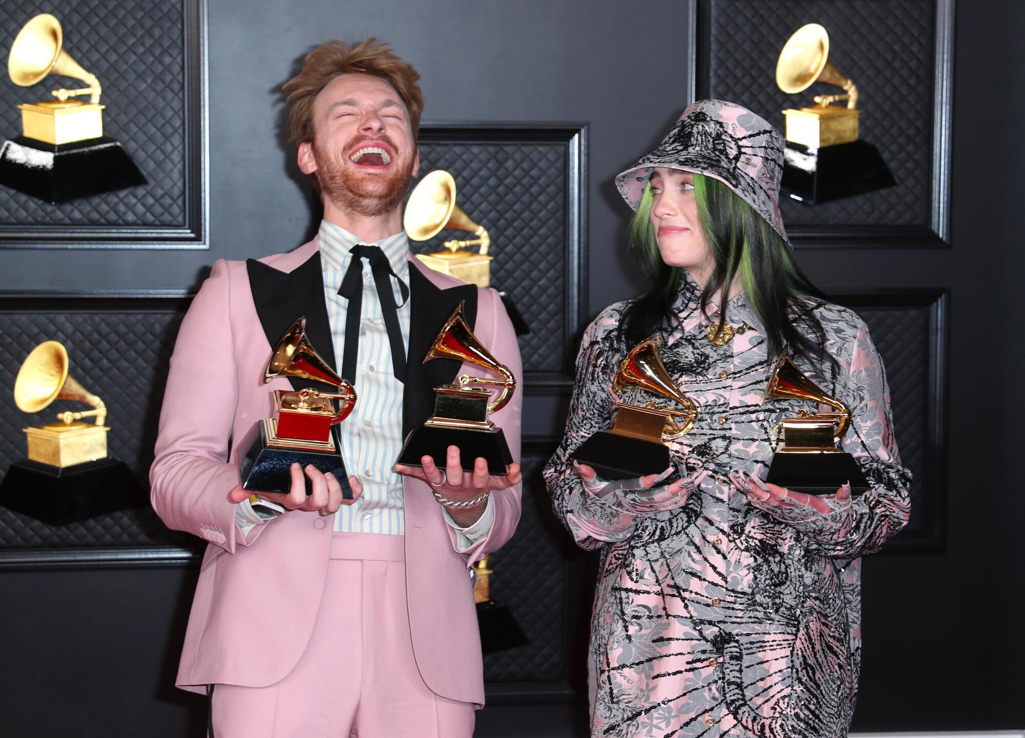 Finneas and Billie Eilish hold two Grammys apiece.