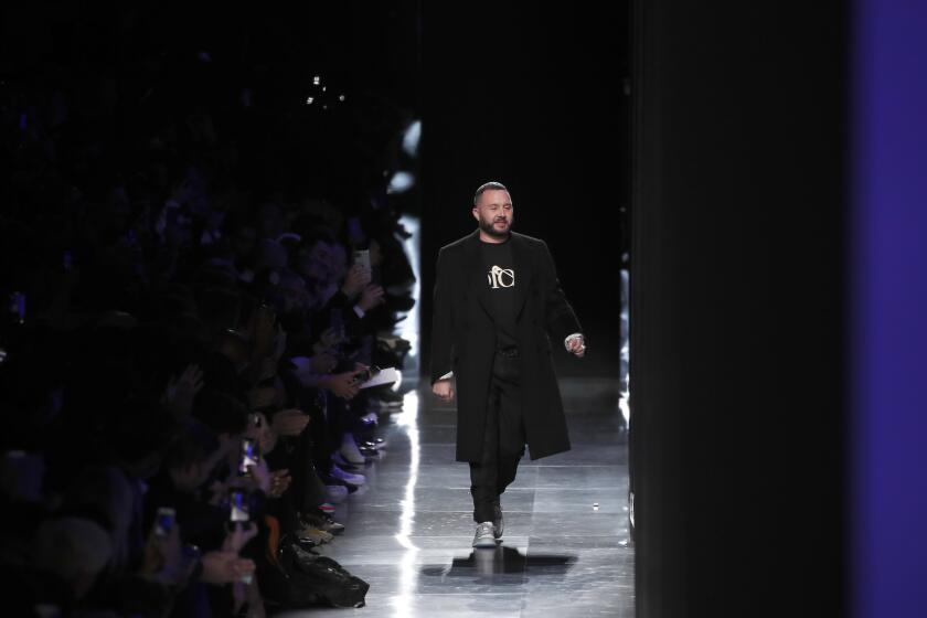 FILE -- In this Jan. 17, 2020 file photo, designer Kim Jones accepts applause after the Dior Homme Mens Fall/Winter 2020-2021 fashion collection presented in Paris. Rome fashion house Fendi announced Wednesday, Sept. 9, 2020 that Kim Jones is taking over from the late Karl Lagerfeld as creative director of haute couture, ready-to-wear and fur collections. Jones will take on the Fendi duties while staying on as artistic director of Dior Homme. (AP Photo/Francois Mori)