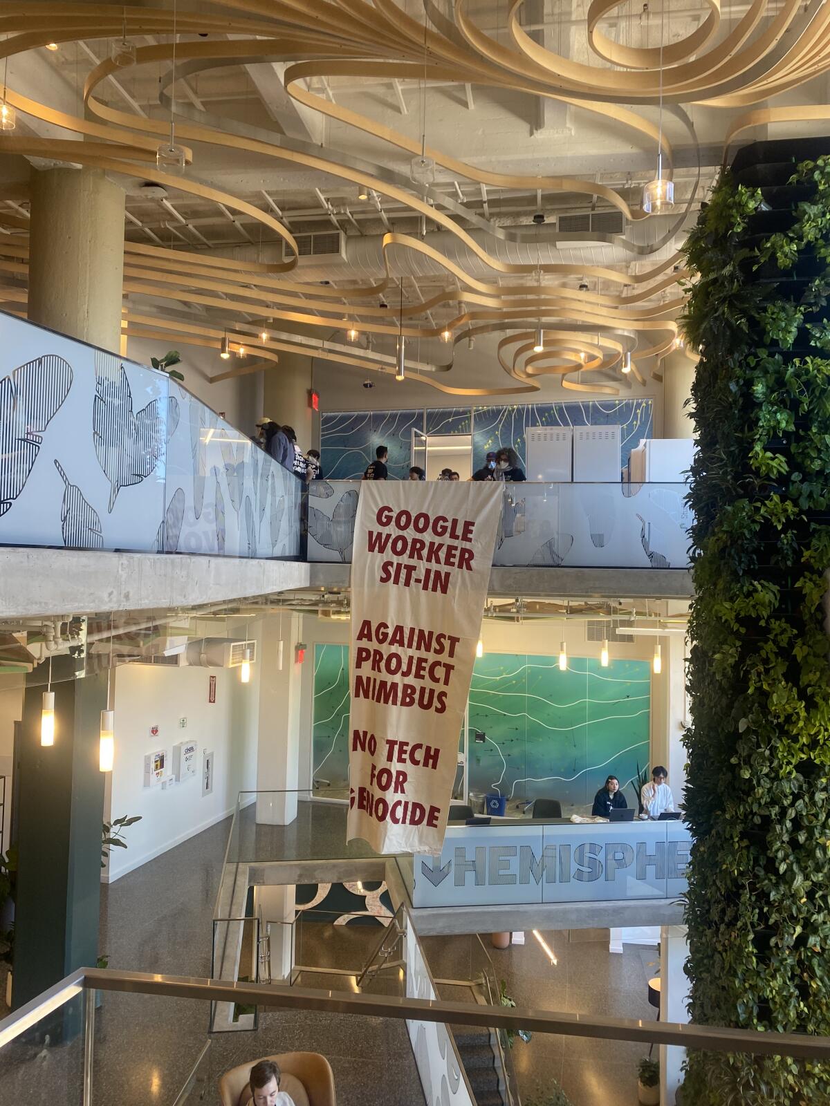 A banner in an office includes the words "Google worker sit-in."