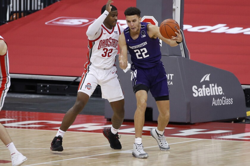 Northwestern's Pete Nance, right, posts up against Ohio State's E.J. Liddell during the second half of an NCAA college basketball game Wednesday, Jan. 13, 2021, in Columbus, Ohio. (AP Photo/Jay LaPrete)