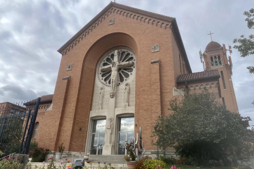 The St. Benedict Church is shown in southwest Baltimore, Monday, Oct. 16, 2023. A Benedictine monk has been suspended from ministry after the Catholic Archdiocese of Baltimore recently became aware of a payment he made several years ago to settle sexual harassment allegations. (AP Photo/Lea Skene)