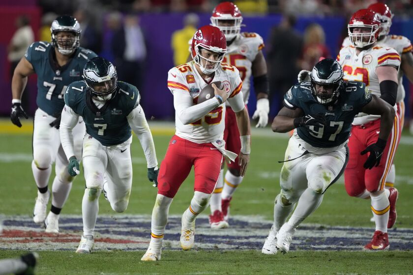 Kansas City Chiefs quarterback Patrick Mahomes (15) runs against the Philadelphia Eagles during the second half of the NFL Super Bowl 57 football game, Sunday, Feb. 12, 2023, in Glendale, Ariz. (AP Photo/Godofredo A. Vasquez)